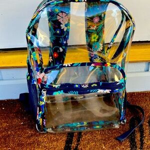 A vera Bradley backpack has three tiny tears on the cupholder.